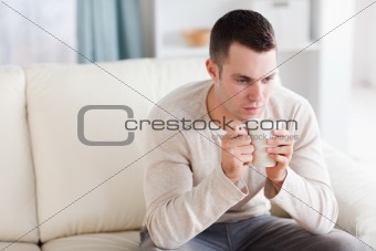 Young man having a coffee
