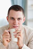 Portrait of a man having a tea