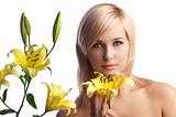 beauty blond girl with yellow lily