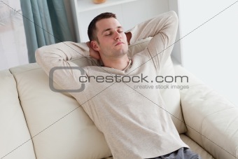 Man resting on a sofa