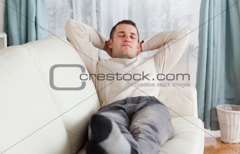 Young man resting on a sofa