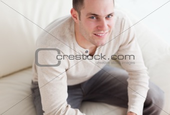 Handsome man sitting on a couch