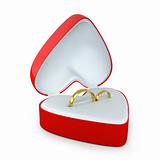 Pair of wedding rings in a heart shaped box