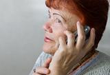 Seventy year old woman with cellphone