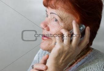 Seventy year old woman with cellphone