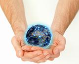 Masculine hands holding a connected planet globe