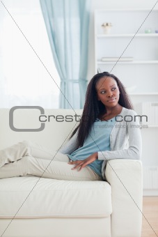 Woman relaxing in livingroom