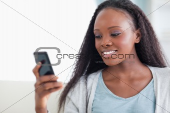 Close up of woman reading a text message