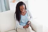 Smiling woman happy about text message