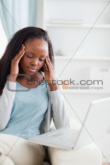 Close up of laptop gives woman a headache