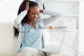 Woman angry at her laptop