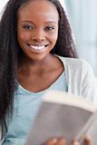 Close up of smiling woman reading