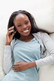Close up of woman lying on couch with phone