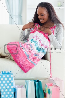 Close up of woman with her shopping on sofa