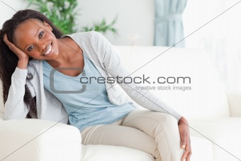 Woman leaning on armrest