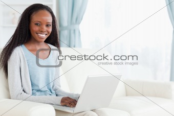 Woman typing on her notebook