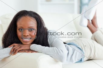 Woman releasing tension on couch