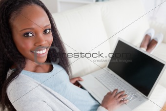 Woman on couch with her laptop