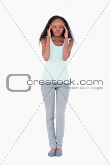 Woman having headache on a white background