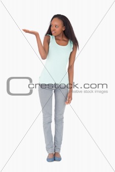 Woman holding something up on white background