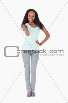 Woman giving thumb up on white background