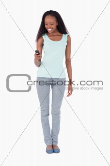 Woman texting on white background