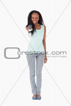 Woman showing her phone on white background