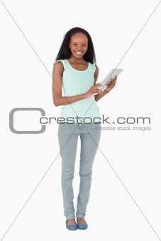 Woman using tablet computer on white background