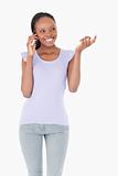 Close up of woman talking on the phone on white background