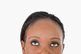 Close up of woman's forehead on white background