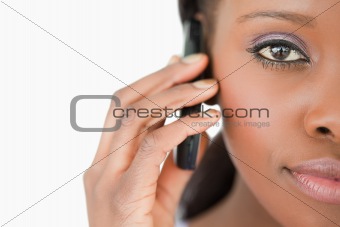 Close up of woman on the cellphone on white background