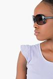 Close up of woman with sunglasses against a white background