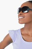 Close up of woman wearing sunglasses on white background