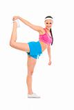 Full lenght portrait of smiling fitness girl doing stretching excersice
