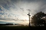 dramatic sky and a cross