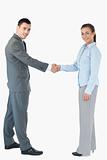 Business people shaking hands against a white background