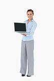 Businesswoman with laptop against a white background