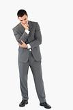 Businessman looking on the floor while thinking