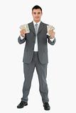 Successful businessman presenting banknotes