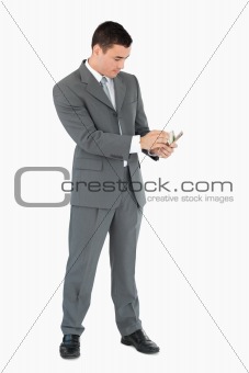 Businessman counting banknotes