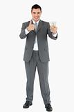 Businessman with banknotes giving thumb up