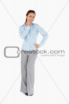 Smiling businesswoman in thoughts