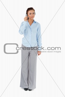 Businesswoman listening to caller with headset on
