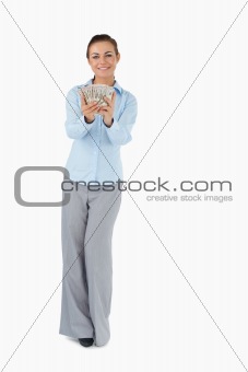 Smiling businesswoman presenting banknotes