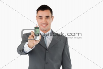 Businessman showing cellphone