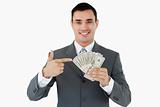 Businessman pointing at bank notes
