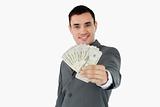 Smiling businessman presenting bank notes