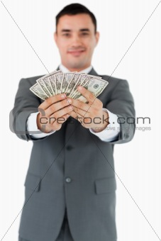 Businessman presenting his banknotes