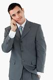 Smiling businessman ringing someone