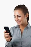 Close up of smiling businesswoman reading text message